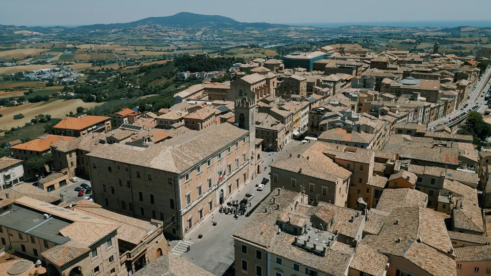 palazzo comunale di Osimo visto dal drone con monte conero sullo sfondo